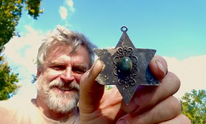 This metal-detecting adventure is a good one. I explored a creek searching for Civil War relics and found a nice handful of bullets and a few other things. But my favorite find was a solid silver Star Of David artifact with a green Eilat stone in the center. | Aquachigger