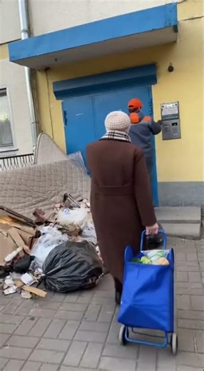 Russian Doorway Divide: Trash Pile Standoff
