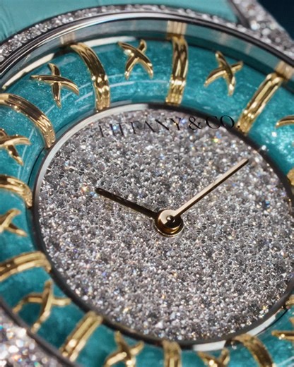 This remarkable timepiece takes its inspiration from Jean Schlumberger’s iconic croisillon enamel bracelets first introduced in 1962. Translating the signature X motif and mastery of paillonné enamel into horological form, it is a tribute to color, craft and legacy. The luminous inner ring appears to be held together by hand-placed golden crosses echoing the delicate yet strong nature of the original bracelets. #TiffanyAndCo #TiffanyWatches Discover more: https://www.tiffany.com/watches/?utm_sou