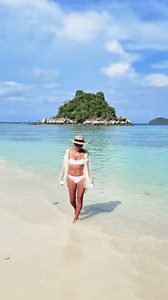 Asian Thai women walking at the beach of Koh Lipe Satun Thailand. Thai girl on the beach of Koh Lipe tropical island