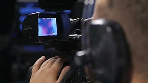 clip-1015684717-camera-operator-working-cinema-broadcast-tv