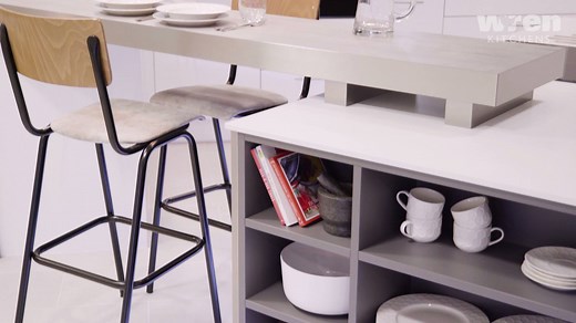Placing a breakfast bar in your kitchen can help you create a natural seating area whilst avoiding the bulky, space-consuming expense of a full kitchen table. Place a few stools behind the breakfast bar and you've got yourself an easy eating area that looks sleek and sophisticated. | Wren Kitchens