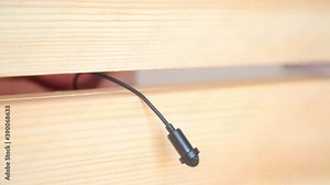 Installing a secret microphone for surveillance and espionage. Secret audio listening.