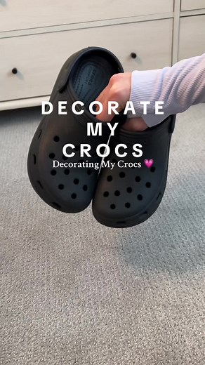 decorating my crocs — so fun with the pops of pink! 💗 the charms were super affordable and come with 30 pieces! #crocs #crocsgang #crocs4life #jibbitz #croccharms #crocsshoes #pinkaesthetic #pinkcrocs