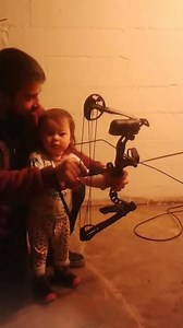 2 year old girl shooting her first compound bow and arrows archery diamond archery atomic