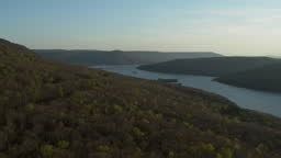 Aerial footage flying sideways over a forest revealing the Tennessee...