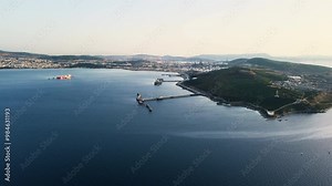 Crude oil and petroleum products terminal port for handling and vessel loading services oil products, Aerial view of pier and refinery