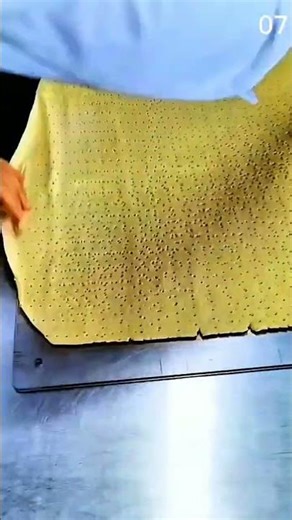 Perforating dough sheet evenly with multi-pronged tool