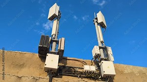 Basic Wi-Fi and cellular communication towers mounted on a wall, providing connectivity and internet access in public places.