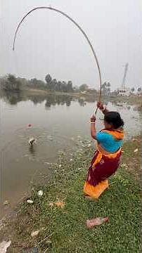Beautiful lady fisherman catching catfishing in village big pond #bass #fish #villagelife #fishing