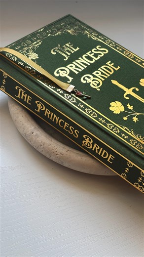 Val on Instagram: "Rebinding THE PRINCESS BRIDE 👰🏼‍♀️ 🗡️🏰👸🏼🥀 💚 (Yes of course you could just take the sticker off like a normal person but… why not just make it into a shelf trophy if you can? Vibes) _____ bookbinding hobby, bookish crafts, DIY book cover, bookbinder, rebinding the princess bride, fantasy romance books, special edition books, valbinds"