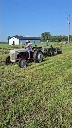 Ford 8N bailing Hay with 14T John Deere baler.