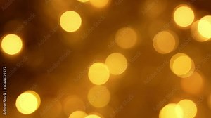 abstract christmas background: vibrant, glowing Christmas lights captured in bokeh style, creating a festive, dreamy effect, warm golden lights in soft focus, ideal for holiday themes and backgrounds