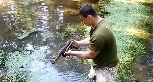 Guy Goes 'Magnet Fishing' in a Pond and Catches a Submachine Gun
