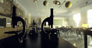CGI Microscopes on lab table in a well lit classroom during school hours
