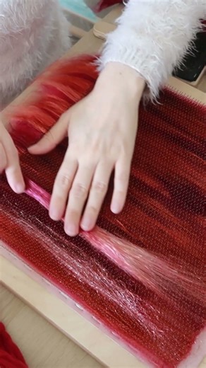 Blending "Garnet Halo" fiber blend on my blending board