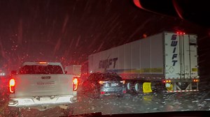 CHP escorting traffic through Grapevine due to snow and ice on I-5