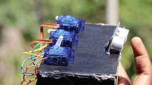 Micro servos with random servo shaft movements when obstacle is sensed by an ultrasonic sensor held in hand
