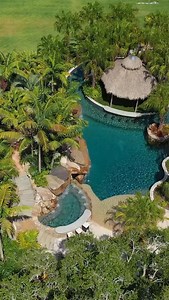 3K reactions · 139 shares | From Start to Finish, We Design and Build Insane Pools! 12-foot tall grotto, beach entry, water slide, spa with built-in bar, lazy river, tiki hut, and beautiful landscaping. What do you think of this award-winning project? #insanepools #lucaslagoons #pool | Lucas Lagoons Design | Facebook