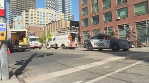 Garbage truck collides with overhead power lines downtown Toronto