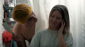 Happy married couple taking a shower together and laughing