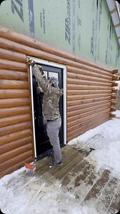 Installing exterior door #construction #logcabin #wood #log #selfbuild #woodworking #diy #buildingahouse #cabin #carpentry #door #doors #exterior #exteriordoors | The Roaming Lions