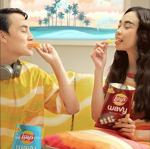 13K views · 1K reactions | Maymay and Edward are riding the Barbecue and Cheese flavor waves of NEW Lay’s Wavy. Find out what all the fun is about when you give in to this deliciously distracting snack. 30 pesos lang! #LaysDeliciouslyDistracting | Lay's Philippines | Facebook