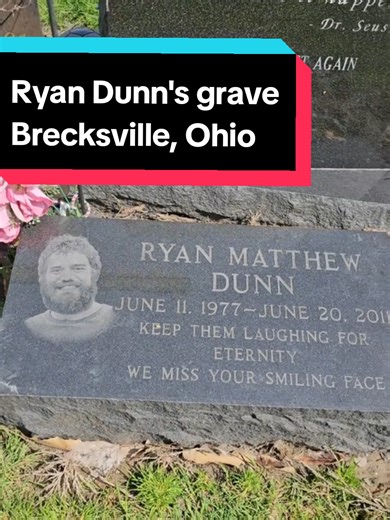 Jackass star Ryan Dunn's grave in Brecksville, Ohio in Brecksville Cemetery and has become a site for fans of the Jackass star, who died in a car crash in 2011. The grave is notable for its unique orientation, with headstones facing away from each other, and is near a water tower and brown guardrails, often identified by the