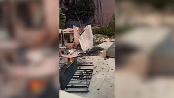 Actor returns to pile of ashes where his Los Angeles home of 13 years once stood