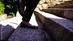 Woman walking up stairs, slow motion