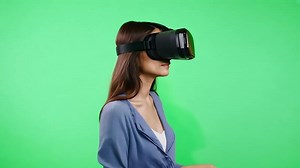 Download Woman Experiencing Virtual Reality on green screen background. for free