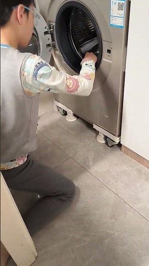 Boy spins toy car in washing machine in Gansu, China