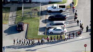 As nation grieves, shooting suspect appears in courtroom