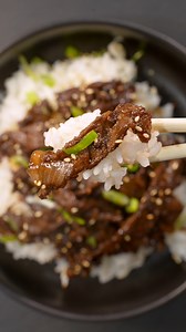 Easy & Low Effort Beef Bulgogi Yield - 5 For the Beef - 1.8 Lbs Ribeye or any tender steak (Shaved Beef is better) Marinade - 6 Green Onions, Chopped 1 Yellow Onion, thinly sliced 6 Cloves Pressed Garlic 2 Inch piece of Ginger, grated 1 Tbsp Sesame oil 3/4 Cup Lite soy sauce 1/4 Cup Brown sugar (or more to taste) 1 Tbsp Onion Powder 1 Tsp Fresh crack of black pepper 1/4 Cup Water 2 Tsp Sesame Seeds 2 Tbsp Rice Wine Vinegar For the Bowl - Sesame Seeds Cooked Rice (Calrose Rice) Scallions ————————
