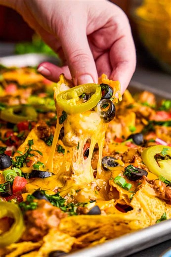 58K views · 1.2K reactions | The ultimate nacho recipe! Crispy chips with melted cheese, ground beef, refried beans, and all of your favorite toppings. https://thestayathomechef.com/ultimate-nacho-recipe/ | The Stay At Home Chef | Facebook