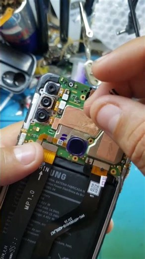 How was the makeshift repair done on the Samsung A21s power button?