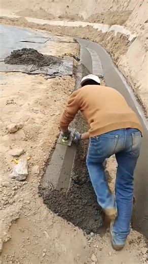 Leveling a Drainage ditch slope.