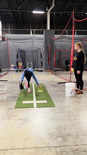 ⚠️New drill alert ⚠️ Coach Hailey combined a drive-up/jump drill (this pitcher needs to feel the rise part of the rise-and-fall) with the floor-is-lava drill for stability and balance on the plant foot. Anya jumped today! We call it the "glide" where front foot is in the power K kick and back leg is, simultaneously, dragging up-on-toes. This gets us so much power compared to an early landing with the front foot, and *then* a drag forward. | Redline Fastpitch