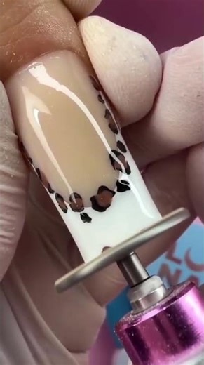 the process of tidying up the tips of nails using a nail file