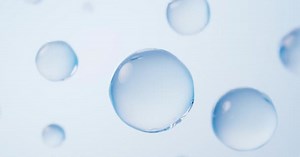 Abstract Water Drops Floating on Light Blue Background