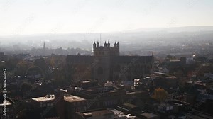 Exeter, UK. A hazy horizon with Exeter cathedral appearing as a holy silhouette amongst the urban environment