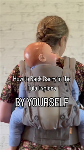 🔹 How to Back Carry with the Tula Explore 🔹 ➡️ Developmental Milestone - Is your baby sitting? Yes - back carry is the best! No - you will need to wait a little bit longer until they can. 1. Put on the waist belt on your front like you are doing a front carry (but higher so you can see them over your shoulder easily). 2. Position baby in front carry, pull up the back panel to a safe height and put on the shoulder straps and back strap. 3. Bring one arm up between the shoulder strap and your ne