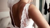 Bride getting dressed in her bedroom. HD1080p
