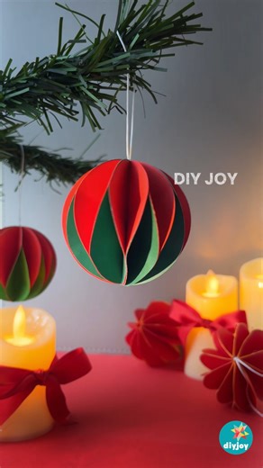 Christmas is officially here! 🎅 If you love crafting your own holiday decorations, you have to try these easy DIY paper ornaments. They're a simple, fun project that anyone can make this holiday season. Try it with your family or friends. It's also perfect for Christmas kids crafts! #christmasdecor #diydecor #diyornaments #crafts #diy | DIY Joy