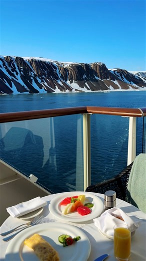 On board Silver Endeavour, even the coldest Arctic mornings begin in comfort. ​ ​ You can enjoy breakfast, cozy blankets, and awe-inspiring polar views delivered right to your private veranda—an intimate start to another extraordinary day of exploration. | Juanita's Travel TPI