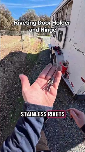 Riveting on door holder and hinge for a Sundowner Horse Trailer