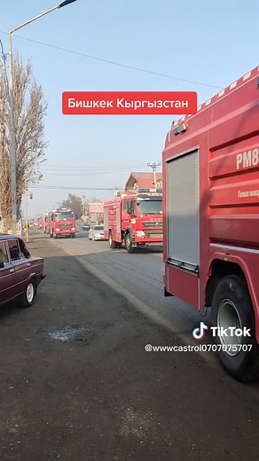 Emergency Response: Red Fire Trucks in Urban Parade