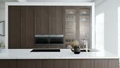 Kitchen minimalism. Wooden kitchen with large long island and bar...