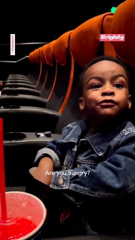 The intense way this kid eats popcorn at the movie theater is blowing our minds