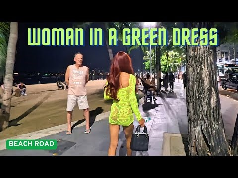 PATTAYA, THAILAND, (4K30FPS), WOMAN IN A GREEN DRESS, BEACH ROAD, NOV 9.